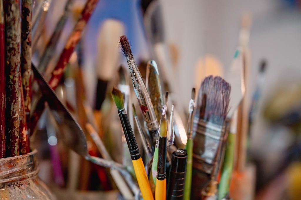 close up shot of paintbrushes in a studio